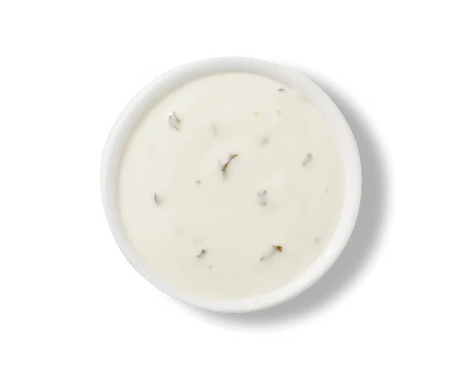 Culver’s Buttermilk Ranch dressing in a small cup, creamy and rich with herbs