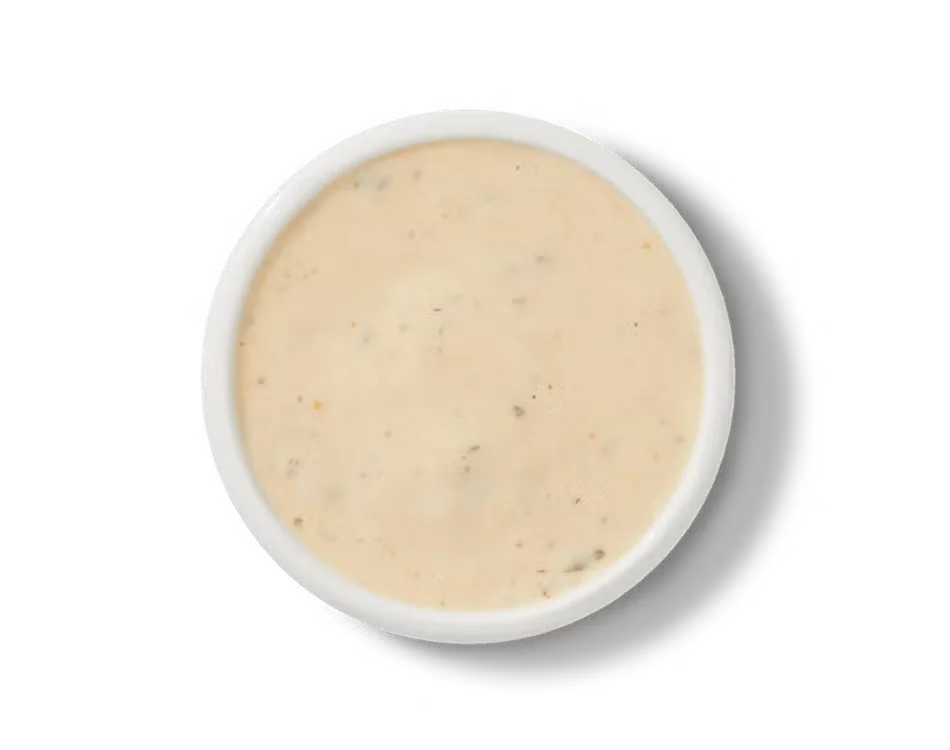 Culver’s® Signature Sauce in a small dipping cup, creamy with herbs and spices