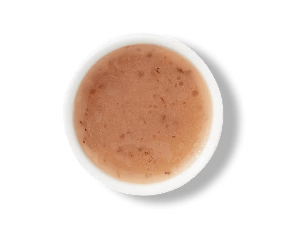 Culver’s® Vinaigrette dressing in a small cup, light and zesty with a clear, golden appearance