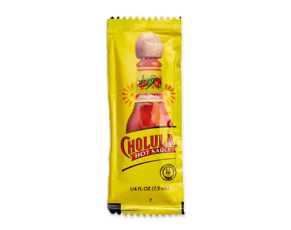Culver’s Hot Sauce in a small cup, bold red with a spicy and tangy flavor