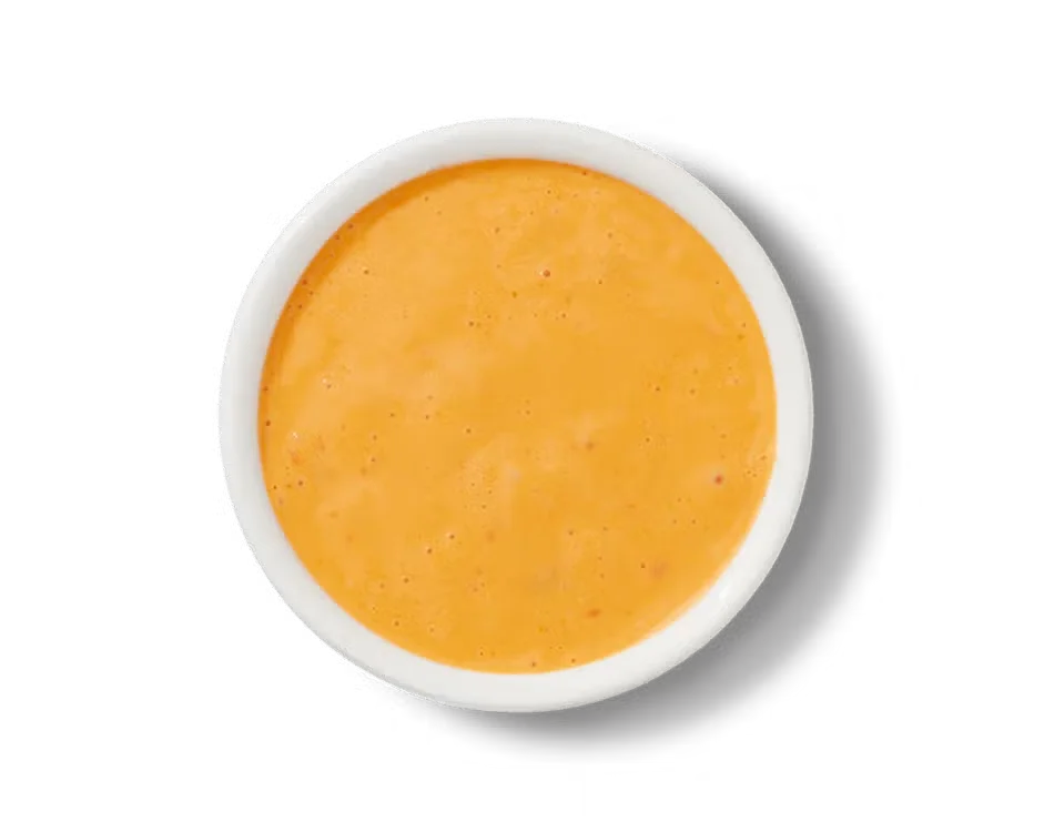 Culver’s Ken’s® Boom Boom Sauce in a small cup, creamy orange dip with bold, tangy flavor